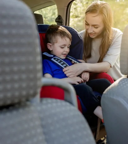 protection-car-hands-caucasian-woman-is-fastening-security-belt-child-who-is-sitting